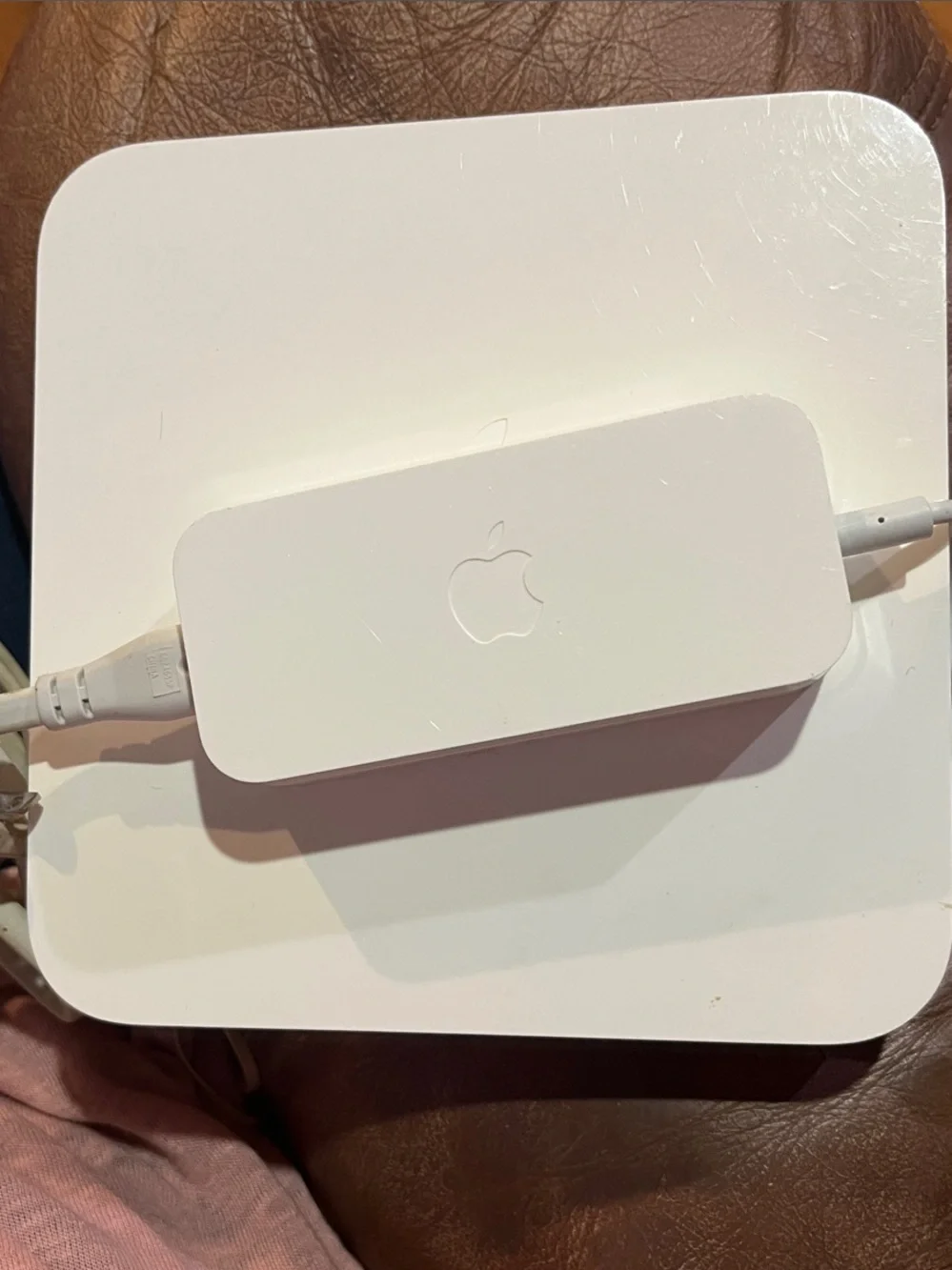 Apple AirPort Extreme base station with power supply.
